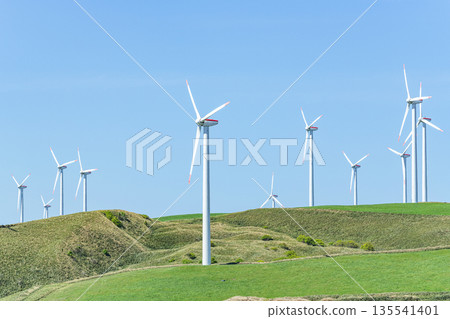 A wind power plant towering over a hill (image of natural energy) A wind power plant towering over a hill (image of natural energy) 135541401