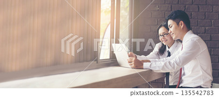 Banner Two businesspeople meeting work at office desk. Teamwork partners team with Business strategy chart graph, infographic financial report. Team partner planning excel stat report with copy space Banner Two businesspeople meeting work at office desk. Teamwork partners team with Business strategy chart graph, infographic financial report. Team partner planning excel stat report with copy space 135542783