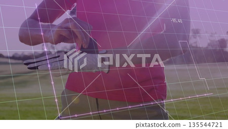 Adjusting woman in pink polo gray pants fastening golf glove on grass fairway with metrics overlay 135544721