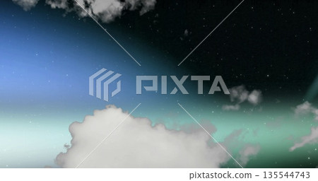 Showing twilight sky merging blue-green horizon into expanse, with fluffy clouds and distant stars 135544743