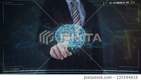 Pointing suit-clad executive manipulating brain network hologram on display in control room Pointing suit-clad executive manipulating brain network hologram on display in control room 135544819