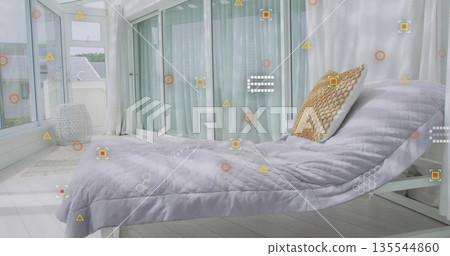 Showcasing white daybed wearing quilted gray cover in sunlit sunroom, with sheer curtains Showcasing white daybed wearing quilted gray cover in sunlit sunroom, with sheer curtains 135544860