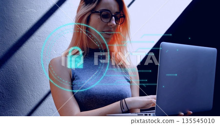Working woman wearing sleeveless top typing on laptop in home office, with digital lock icon Working woman wearing sleeveless top typing on laptop in home office, with digital lock icon 135545010