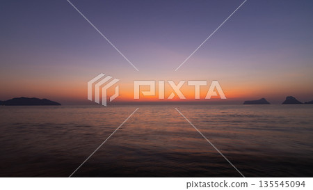 Soft morning light before sunrise with a calm sky and gentle color tones Soft morning light before sunrise with a calm sky and gentle color tones 135545094