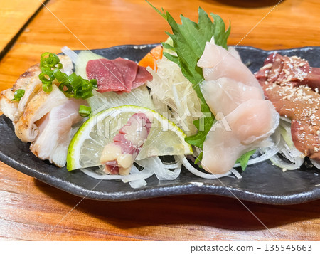 Fresh chicken sashimi, including chicken breast, chicken liver, and chicken fillet. Fresh chicken sashimi, including chicken breast, chicken liver, and chicken fillet. 135545663