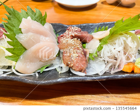 Fresh chicken sashimi, including chicken breast and liver. 135545664