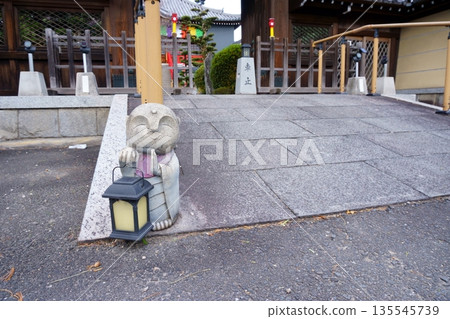 Jizo statue in front of the temple gate at Nyoizan Hojuin Temple 135545739