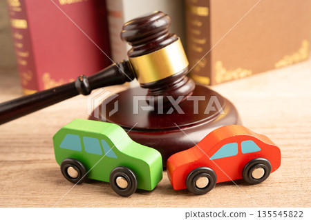 Car accident lawsuit and insurance, Judge hammer with car model. Car accident lawsuit and insurance, Judge hammer with car model. 135545822