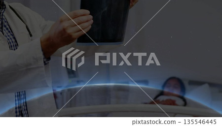 Holding chest X-ray film with stethoscope, doctor examining child patient in hospital, copy space Holding chest X-ray film with stethoscope, doctor examining child patient in hospital, copy space 135546445