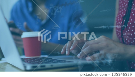 Typing female wearing red blouse at workspace, with laptop smartphone coffee holographic charts Typing female wearing red blouse at workspace, with laptop smartphone coffee holographic charts 135546559