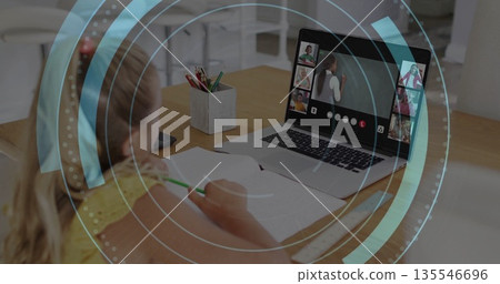 Writing girl attending class in kitchen with laptop, workbook, phone and colored pencils copy space 135546696