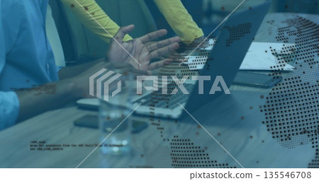 Colleagues discussing at conference table, with laptop notebooks documents pen glass data overlay Colleagues discussing at conference table, with laptop notebooks documents pen glass data overlay 135546708