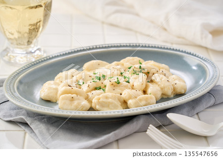 Gnocchi with cheese cream sauce Gnocchi with cheese cream sauce 135547656