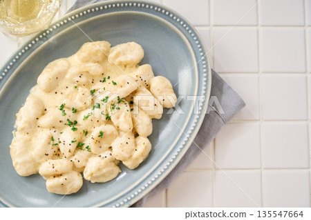 Gnocchi with cheese cream sauce Gnocchi with cheese cream sauce 135547664