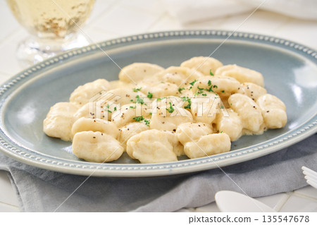 Gnocchi with cheese cream sauce Gnocchi with cheese cream sauce 135547678