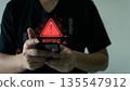 Cybersecurity Warning Alert on Smartphone with Red Hazard Symbol 135547912