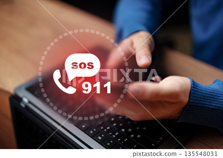 Urgent call for help made from a laptop in a home setting during daytime 135548031