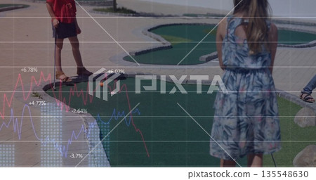 Playing three girls hitting putters on miniature golf course, with brick pathways and turf holes Playing three girls hitting putters on miniature golf course, with brick pathways and turf holes 135548630