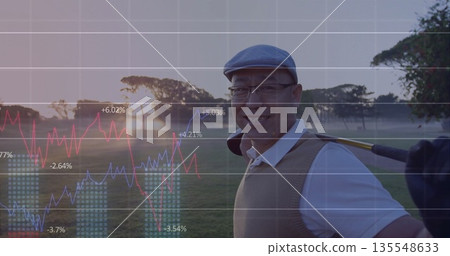 Smiling Chinese golfer holding golf club on fairway at sunrise, in flat cap, copy space Smiling Chinese golfer holding golf club on fairway at sunrise, in flat cap, copy space 135548633