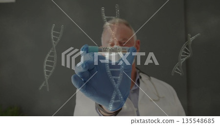 Gloved senior male doctor holding COVID-19 VACCINE vial in lab, with DNA graphics and stethoscope 135548685