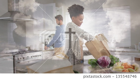 Unpacking produce female home cook taking items from paper bag on marble kitchen island, copy space Unpacking produce female home cook taking items from paper bag on marble kitchen island, copy space 135548746