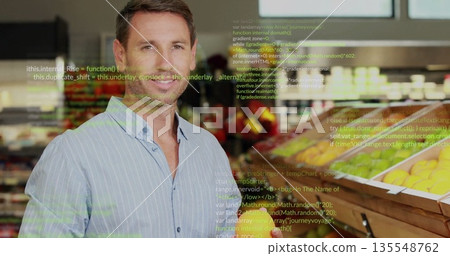 Browsing man picking apples at fruit bins in produce aisle with code overlay, copy space 135548762