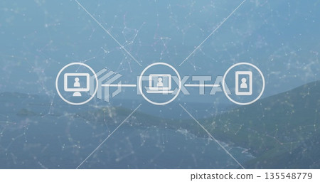 Displaying monitor laptop and phone icons connected with node overlay in coastal interface backdrop 135548779