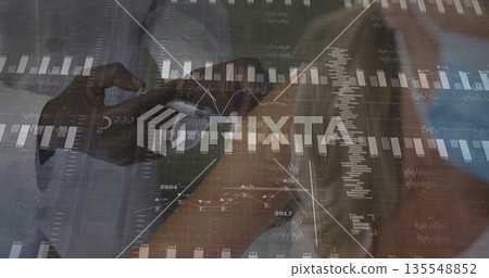 Reviewing financial data professionals using smartphone and stylus in office, displaying graphs Reviewing financial data professionals using smartphone and stylus in office, displaying graphs 135548852