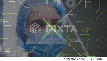 Mid adult female medic scanning circuit overlay with binary digits in operating room, with cap mask Mid adult female medic scanning circuit overlay with binary digits in operating room, with cap mask 135548862