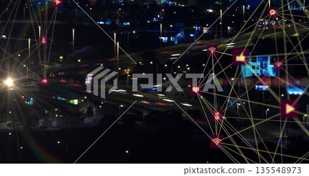 Overlaying connection lines with social media icons above highway junction at night, copy space Overlaying connection lines with social media icons above highway junction at night, copy space 135548973