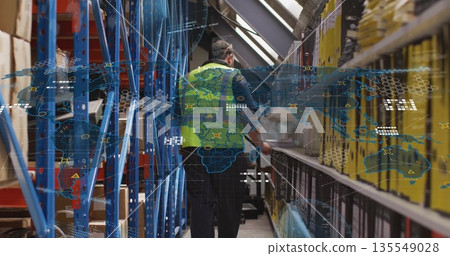 Walking warehouse worker wearing safety vest moving down warehouse aisle, with digital map overlay Walking warehouse worker wearing safety vest moving down warehouse aisle, with digital map overlay 135549028