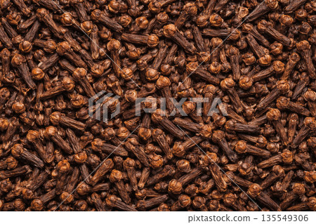 Texture background of densely packed cloves 135549306