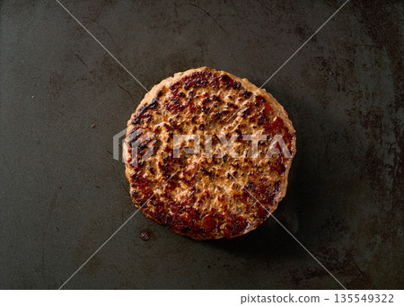 grilling hamburger beef patty on grill, top view.Barbecue traditional hamburger beef patty. grilling hamburger beef patty on grill, top view.Barbecue traditional hamburger beef patty. 135549322