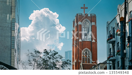 Towering Church with Cross Set Against Clear Sky in Urban Location Shanghai, China Towering Church with Cross Set Against Clear Sky in Urban Location Shanghai, China 135549348