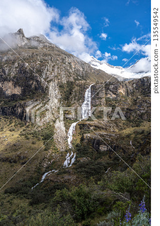 Waterfall cascading from snowy mountains on the Laguna 69 trek, Peru Waterfall cascading from snowy mountains on the Laguna 69 trek, Peru 135549542