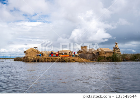 Floating island "Uros Titino" on Lake Titicaca in Peru Floating island "Uros Titino" on Lake Titicaca in Peru 135549544