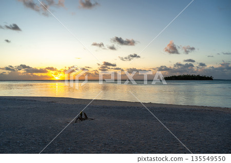 Sunset over a tropical motu on Tikehau Atoll, French Polynesia 135549550