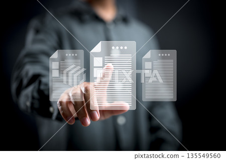 Person Interacting with Digital Document Icons on Transparent Interface Person Interacting with Digital Document Icons on Transparent Interface 135549560