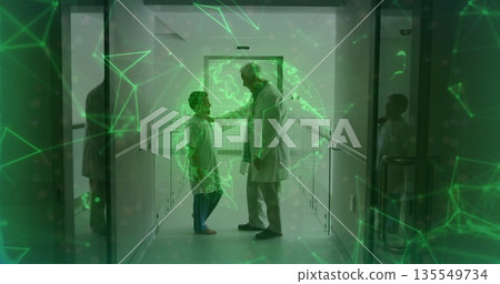 Standing doctor placing hand on boy shoulder in clinic corridor, projecting green digital globe Standing doctor placing hand on boy shoulder in clinic corridor, projecting green digital globe 135549734