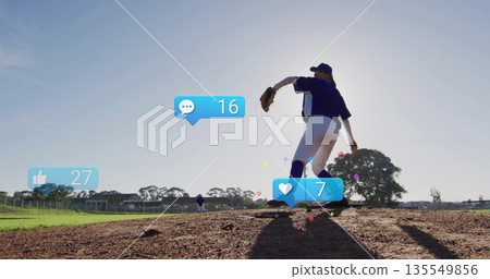 Pitcher wearing cap, blue uniform and glove winding up on mound, with social icons, copy space 135549856