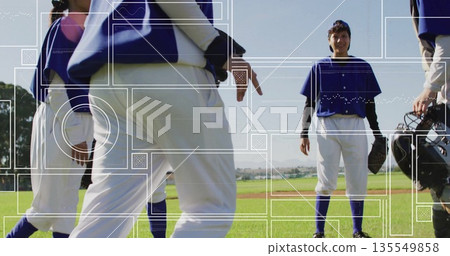 Smiling center player holding glove on diamond with teammates wearing blue jerseys Smiling center player holding glove on diamond with teammates wearing blue jerseys 135549858