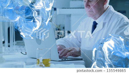 Typing scientist in lab coat examining laptop screen in lab, holographic brain scan, copy space 135549865