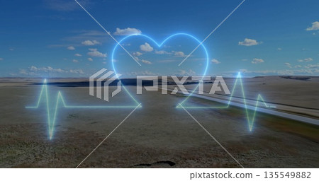Glowing neon-blue ECG waveform pulsing across rural grassland plain, with glowing heart symbol Glowing neon-blue ECG waveform pulsing across rural grassland plain, with glowing heart symbol 135549882
