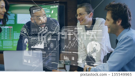 Group of professionals analyzing data in office conference room, with laptop and holographic charts 135549965