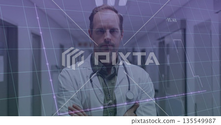 Standing doctor wearing white lab coat and stethoscope crossing arms in corridor, with data overlay 135549987
