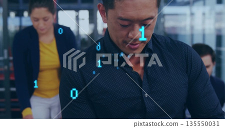 Reviewing code, Asian man wearing dark blue shirt collaborating at workstation, with binary overlay Reviewing code, Asian man wearing dark blue shirt collaborating at workstation, with binary overlay 135550031