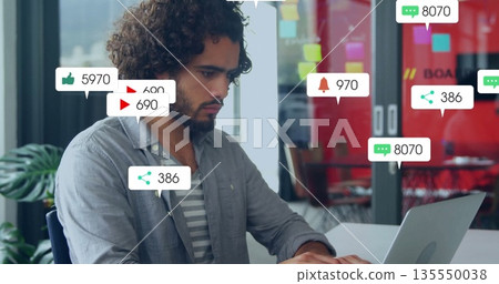 Working curly-haired man typing on laptop in modern office, with notification icons, copy space Working curly-haired man typing on laptop in modern office, with notification icons, copy space 135550038