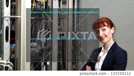 Woman in suit scanning patch cables, server racks in data center, with digital overlay, copy space 135550112