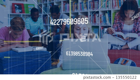 Studying group of five students typing and reading in library area, with laptop and open books Studying group of five students typing and reading in library area, with laptop and open books 135550122