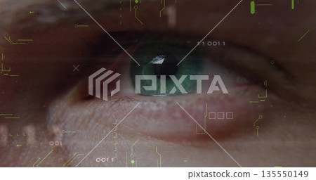 Displaying close-up green eye revealing iris on AR screen, with binary circuits and battery icon 135550149